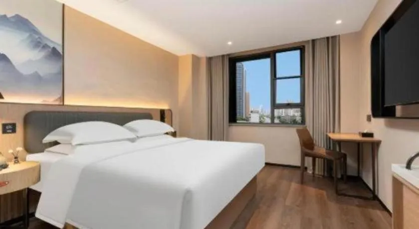 Bed in Echarm Hotel Wuhan Vanke Future Center Wulidun Metro Station