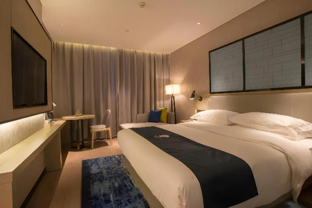 Bed in Echarm Hotel Wuhan Vanke Future Center Wulidun Metro Station