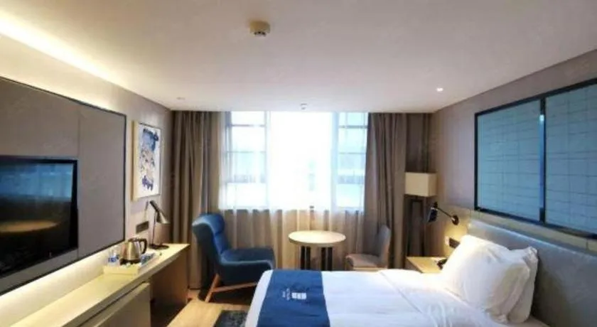 Bed in Echarm Hotel Wuhan Vanke Future Center Wulidun Metro Station