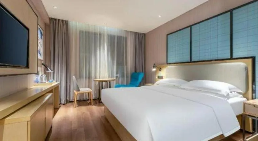 Bed in Echarm Hotel Wuhan Vanke Future Center Wulidun Metro Station