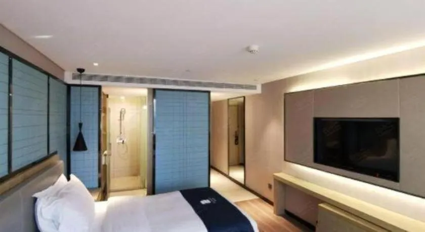 Bed in Echarm Hotel Wuhan Vanke Future Center Wulidun Metro Station