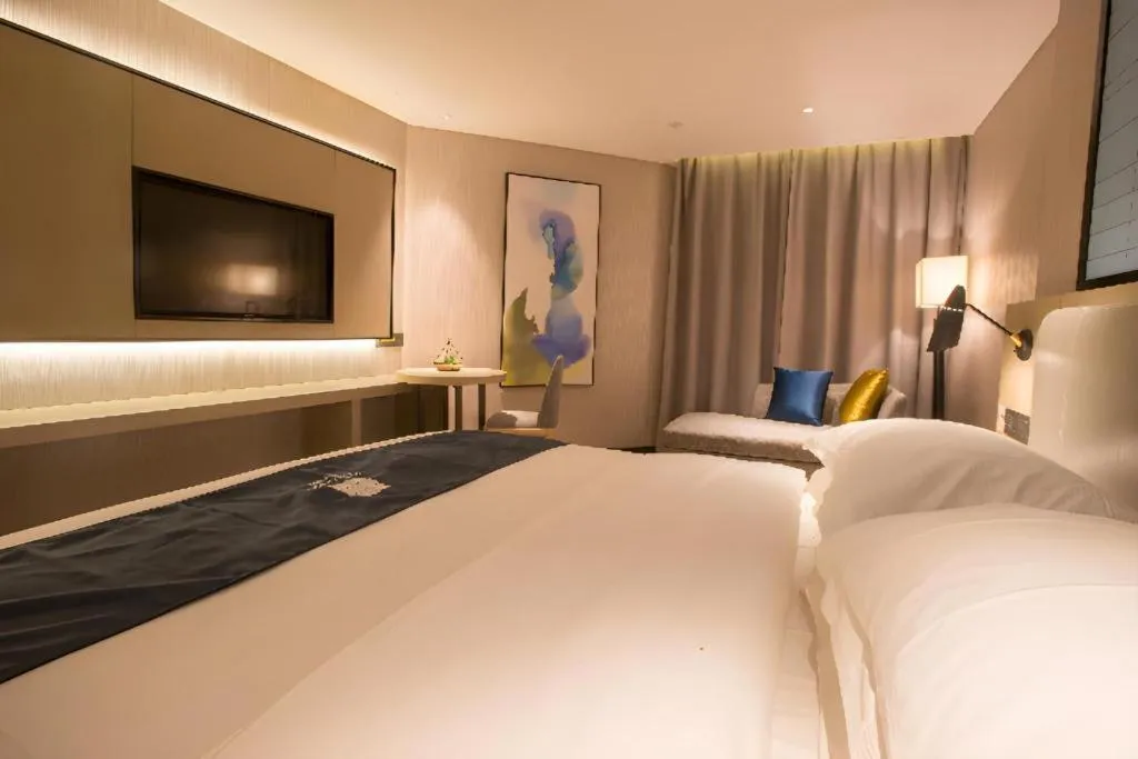 Bed in Echarm Hotel Wuhan Vanke Future Center Wulidun Metro Station