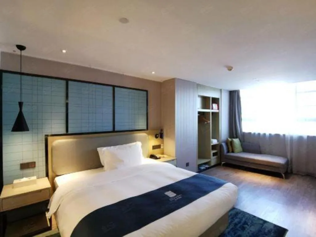 Bed in Echarm Hotel Wuhan Vanke Future Center Wulidun Metro Station