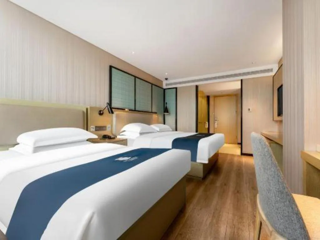 Bed in Echarm Hotel Wuhan Vanke Future Center Wulidun Metro Station