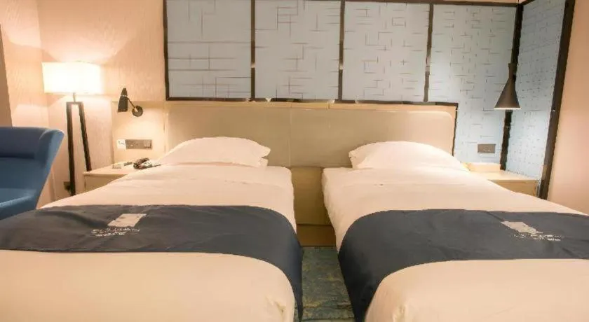 Bed in Echarm Hotel Wuhan Vanke Future Center Wulidun Metro Station