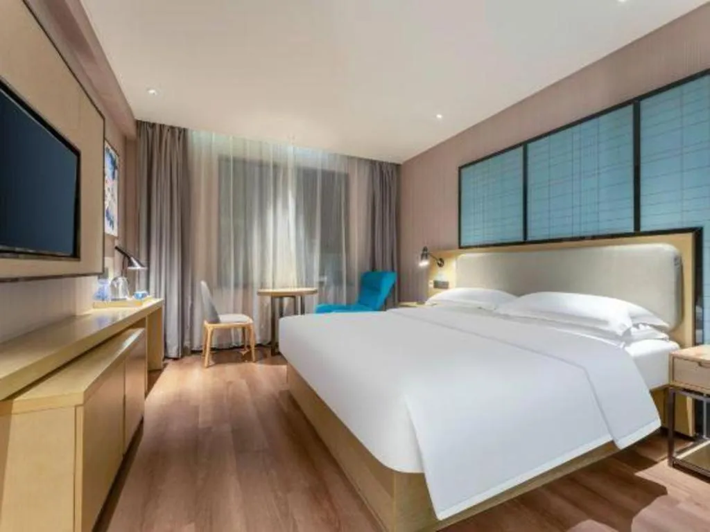 Bed in Echarm Hotel Wuhan Vanke Future Center Wulidun Metro Station