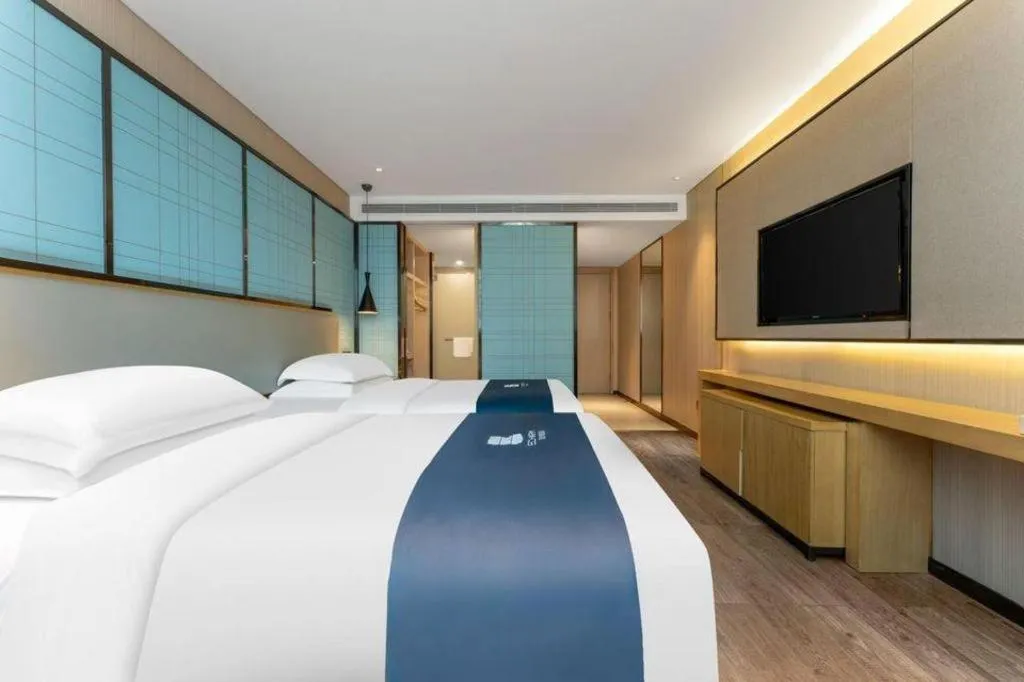 Bed in Echarm Hotel Wuhan Vanke Future Center Wulidun Metro Station