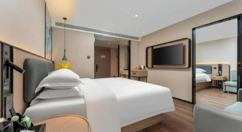 Bed in Echarm Hotel Wuhan Vanke Future Center Wulidun Metro Station