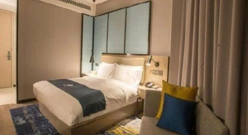 Bed in Echarm Hotel Wuhan Vanke Future Center Wulidun Metro Station