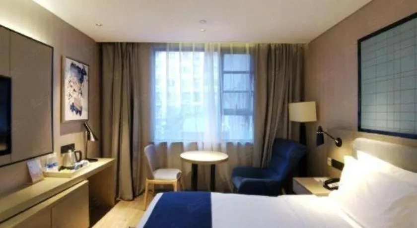 Bed in Echarm Hotel Wuhan Vanke Future Center Wulidun Metro Station