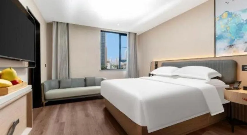 Bed in Echarm Hotel Wuhan Vanke Future Center Wulidun Metro Station