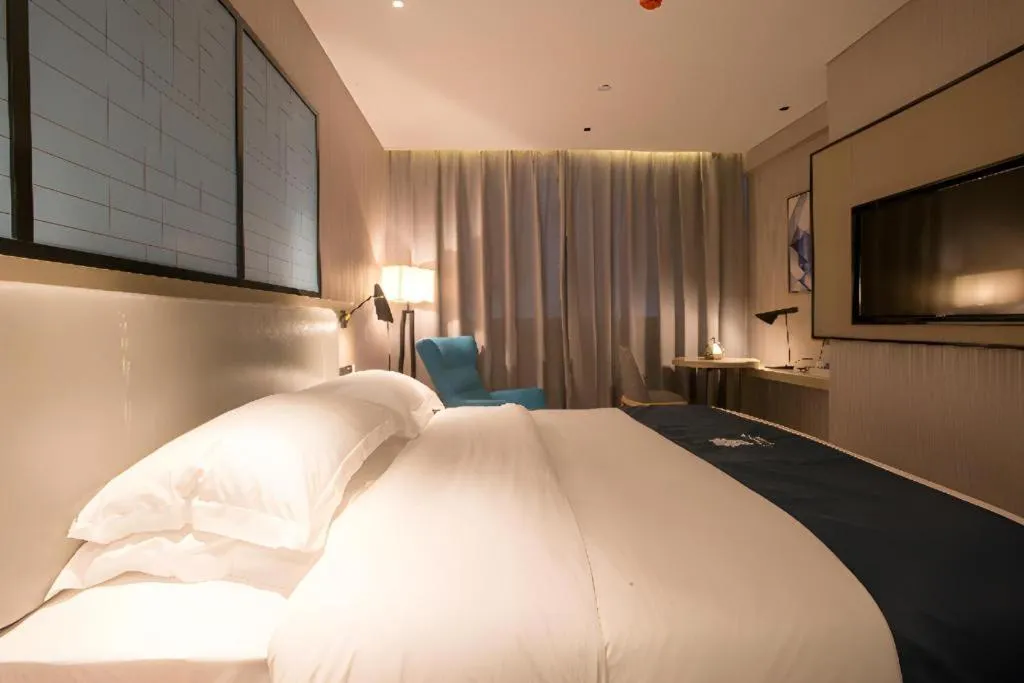 Bed in Echarm Hotel Wuhan Vanke Future Center Wulidun Metro Station