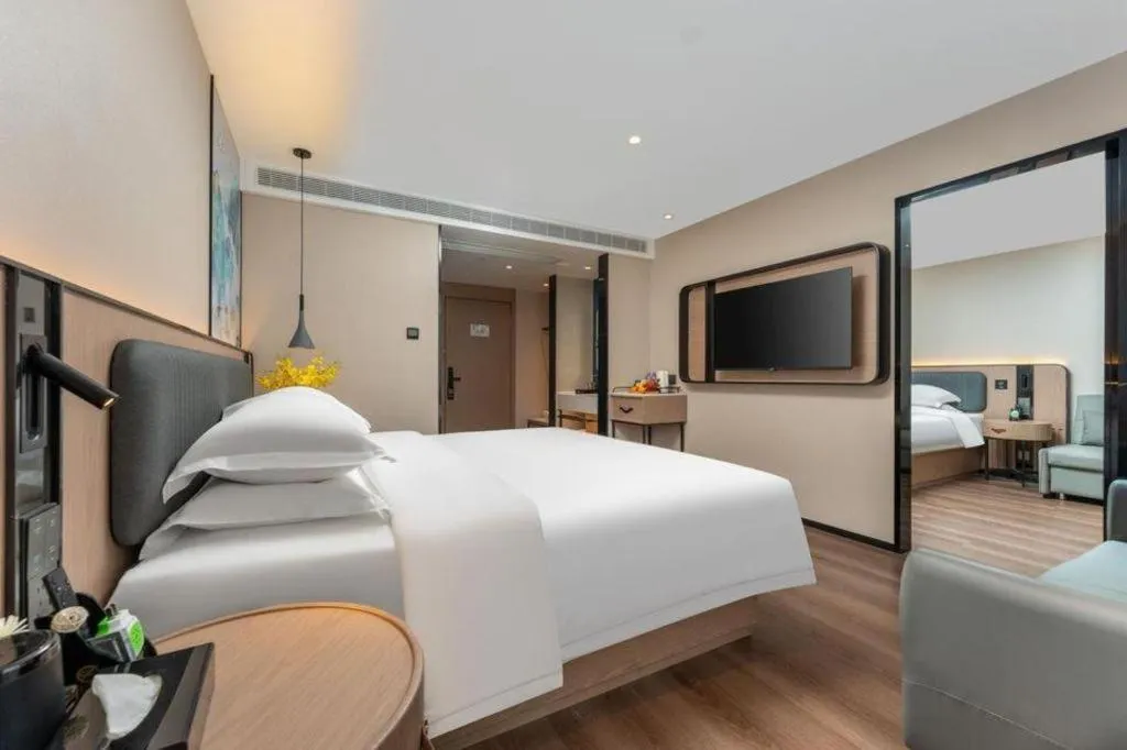 Bed in Echarm Hotel Wuhan Vanke Future Center Wulidun Metro Station