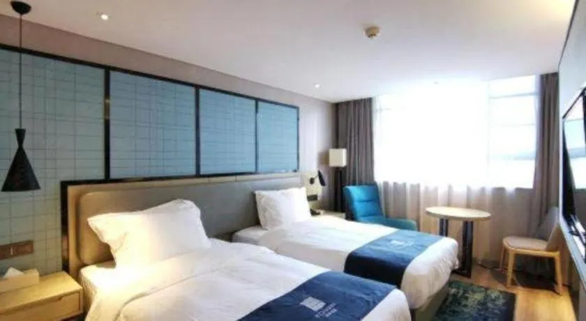 Bed in Echarm Hotel Wuhan Vanke Future Center Wulidun Metro Station