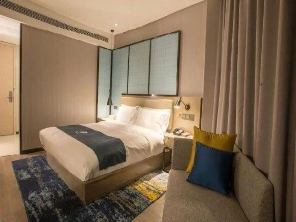 Bed in Echarm Hotel Wuhan Vanke Future Center Wulidun Metro Station