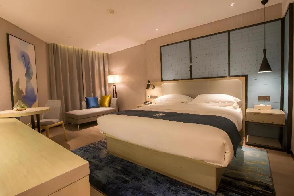 Bed in Echarm Hotel Wuhan Vanke Future Center Wulidun Metro Station