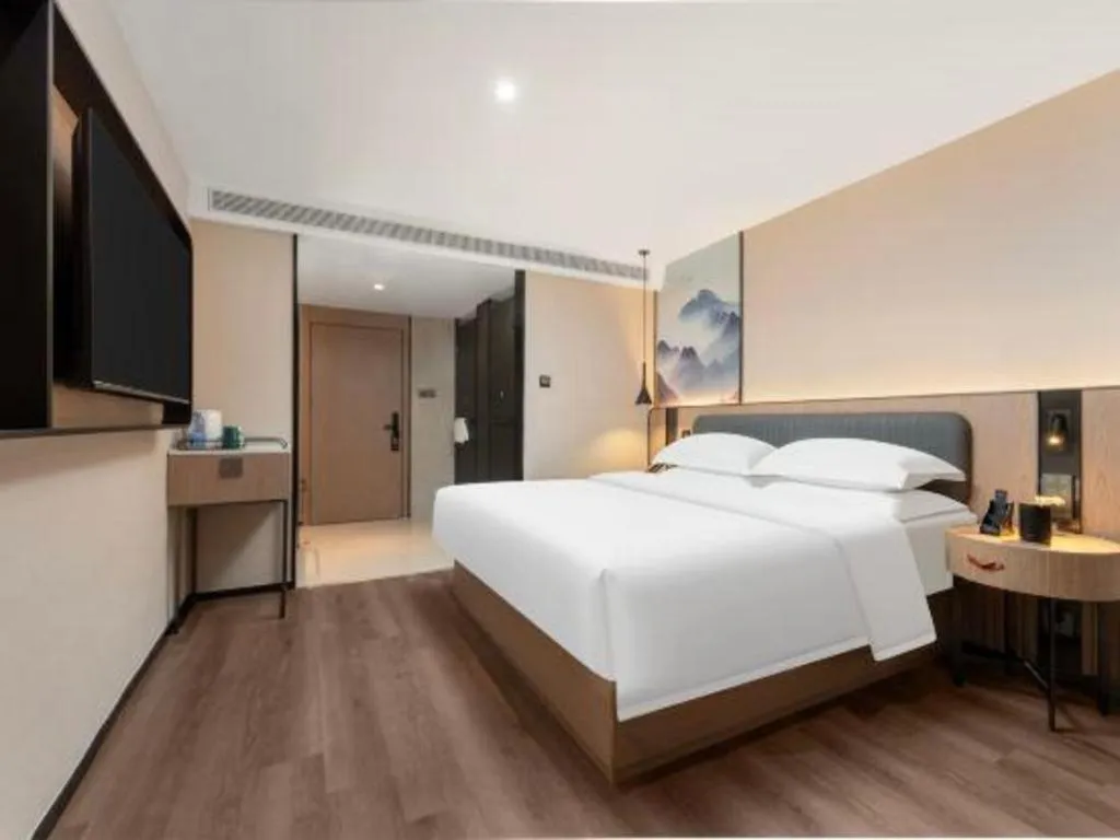 Bed in Echarm Hotel Wuhan Vanke Future Center Wulidun Metro Station