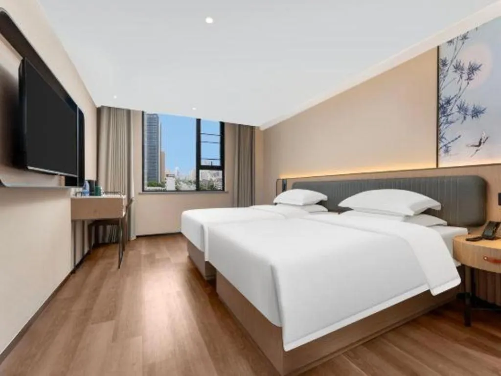 Bed in Echarm Hotel Wuhan Vanke Future Center Wulidun Metro Station