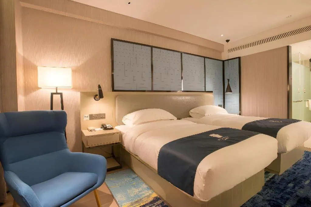 Bed in Echarm Hotel Wuhan Vanke Future Center Wulidun Metro Station