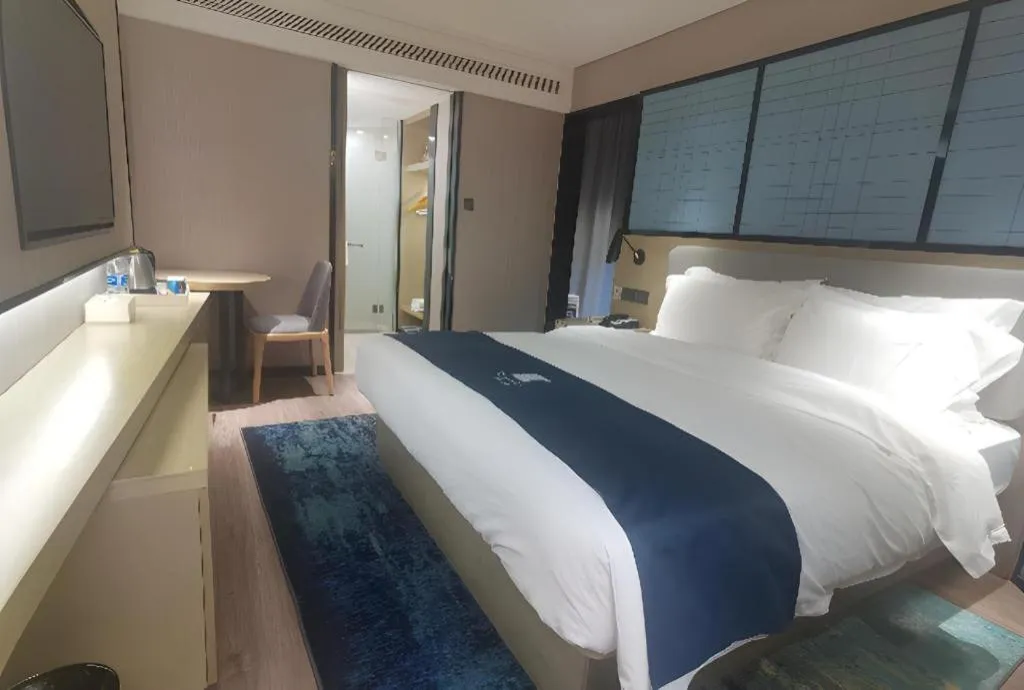 Bed in Echarm Hotel Wuhan Vanke Future Center Wulidun Metro Station