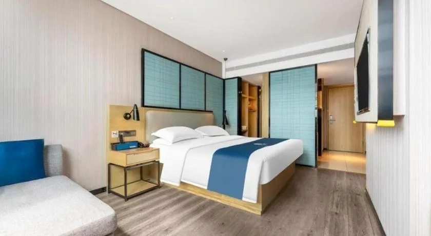 Bed in Echarm Hotel Wuhan Vanke Future Center Wulidun Metro Station