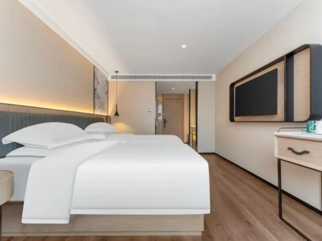 Bed in Echarm Hotel Wuhan Vanke Future Center Wulidun Metro Station