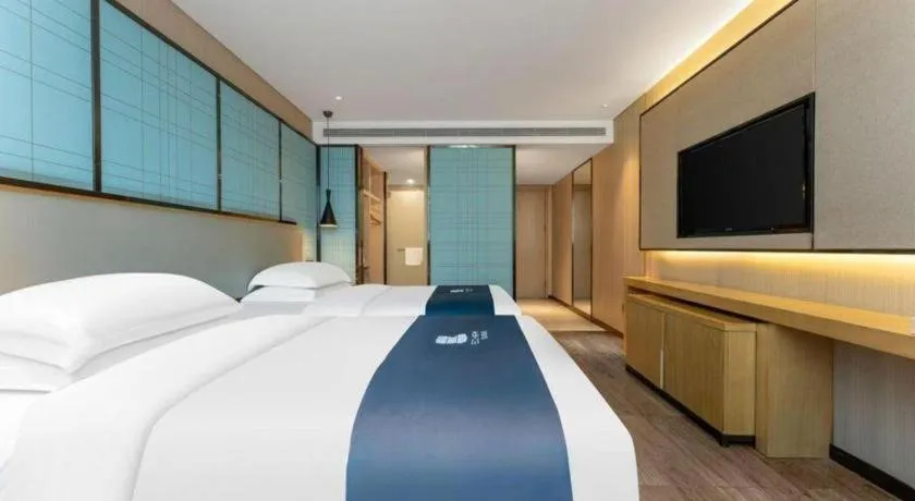 Bed in Echarm Hotel Wuhan Vanke Future Center Wulidun Metro Station