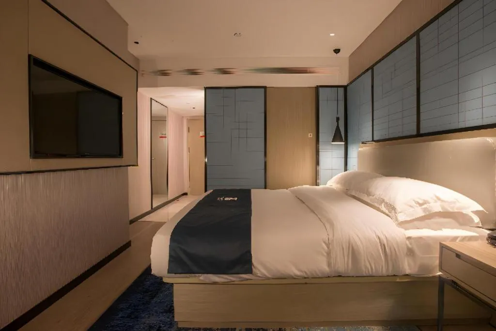 Bed in Echarm Hotel Wuhan Vanke Future Center Wulidun Metro Station