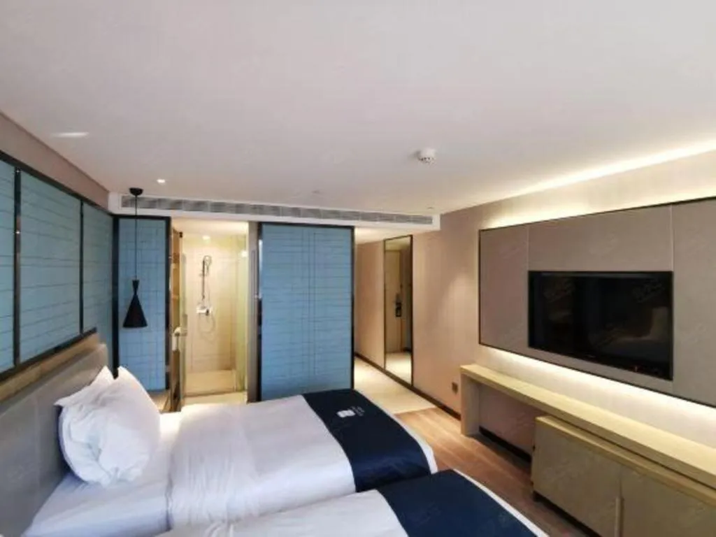 Bed in Echarm Hotel Wuhan Vanke Future Center Wulidun Metro Station