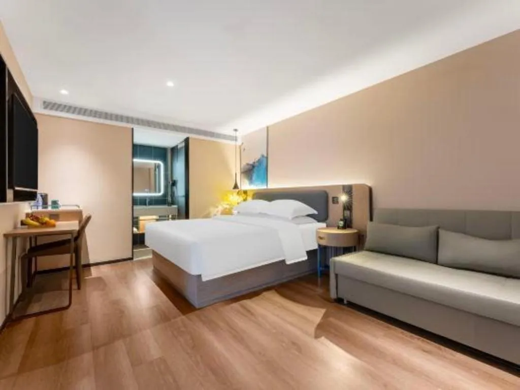 Bed in Echarm Hotel Wuhan Vanke Future Center Wulidun Metro Station