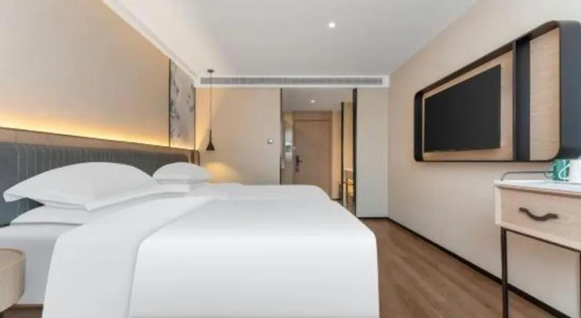 Bed in Echarm Hotel Wuhan Vanke Future Center Wulidun Metro Station