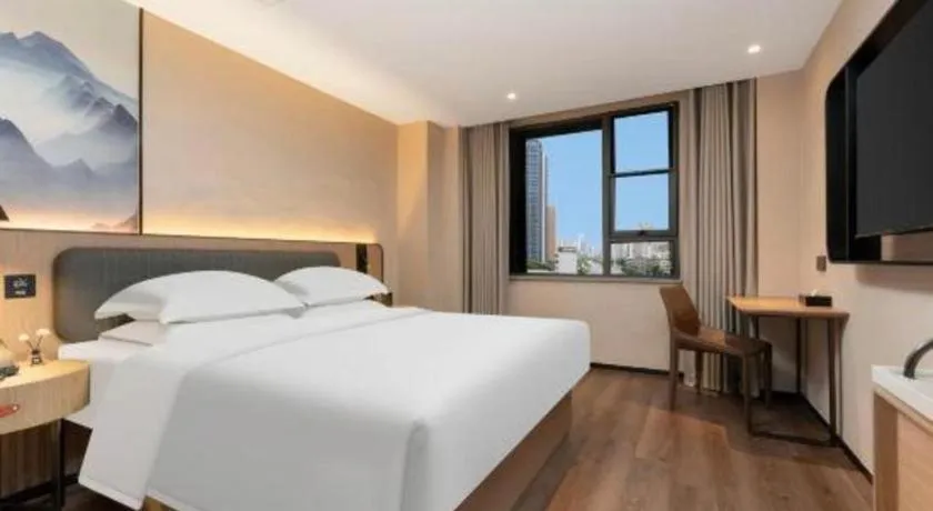 Bed in Echarm Hotel Wuhan Vanke Future Center Wulidun Metro Station