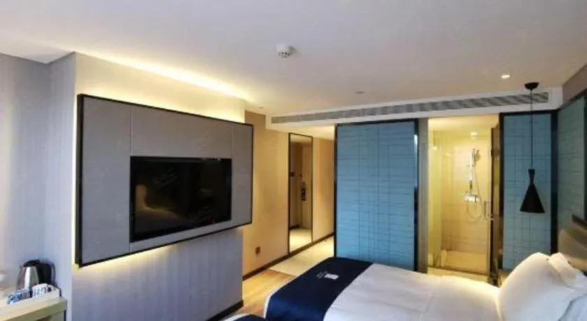 Bed in Echarm Hotel Wuhan Vanke Future Center Wulidun Metro Station