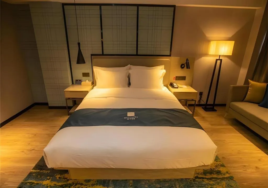 Bed in Echarm Hotel Zibo Gaoqing Zhongcheng Inernational