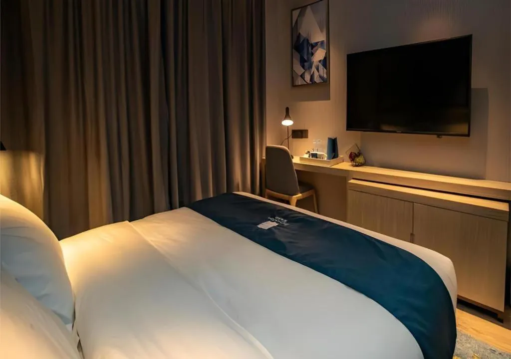 Bed in Echarm Hotel Zibo Gaoqing Zhongcheng Inernational