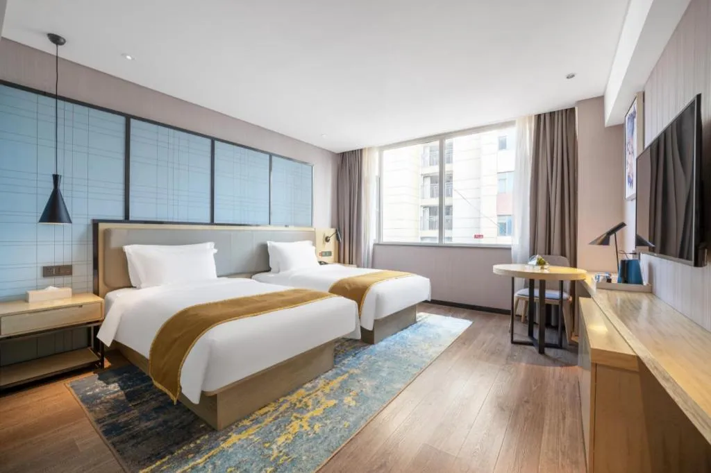 Bed in Echarm Hotel Zibo Gaoqing Zhongcheng Inernational