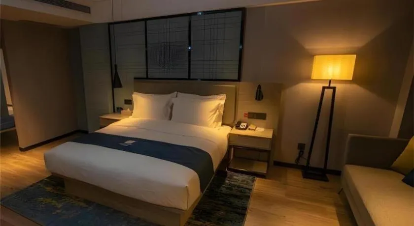 Bed in Echarm Hotel Zibo Gaoqing Zhongcheng Inernational