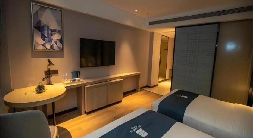 Bed in Echarm Hotel Zibo Gaoqing Zhongcheng Inernational