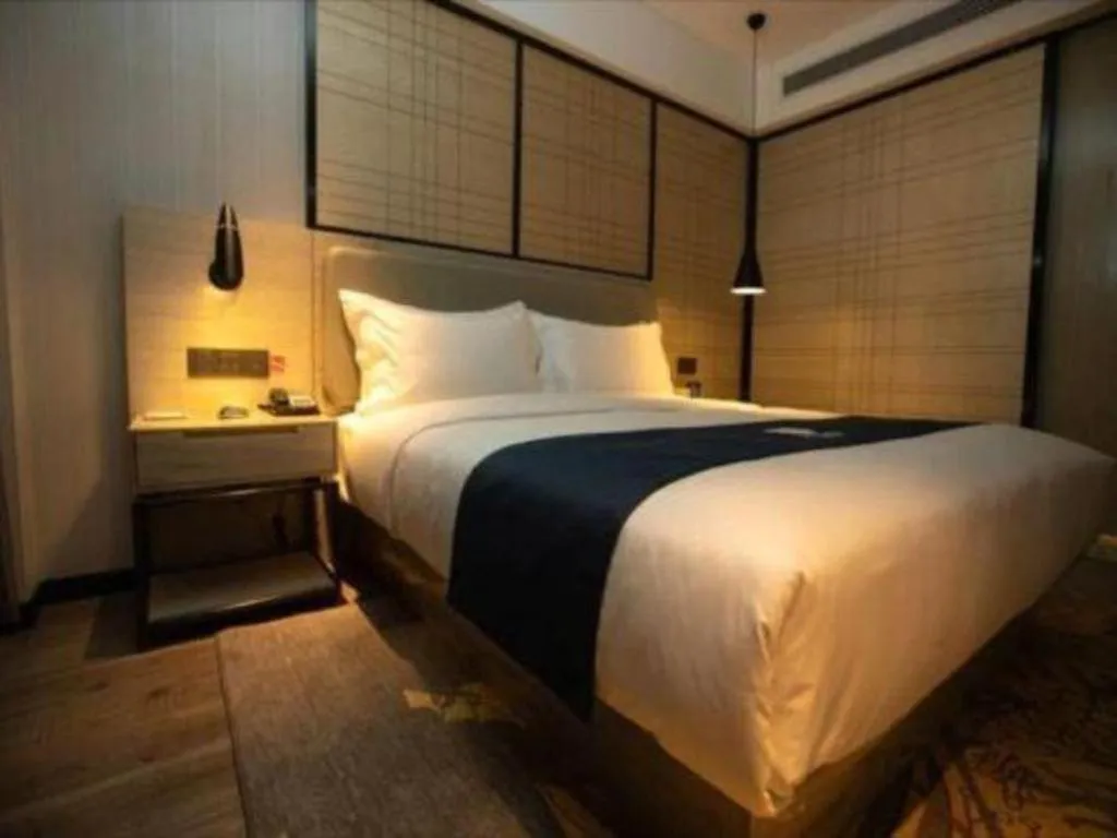 Bed in Echarm Hotel Zibo Gaoqing Zhongcheng Inernational