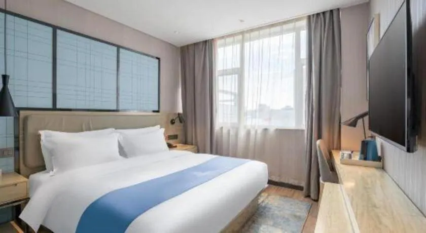 Bed in Echarm Hotel Zibo Gaoqing Zhongcheng Inernational