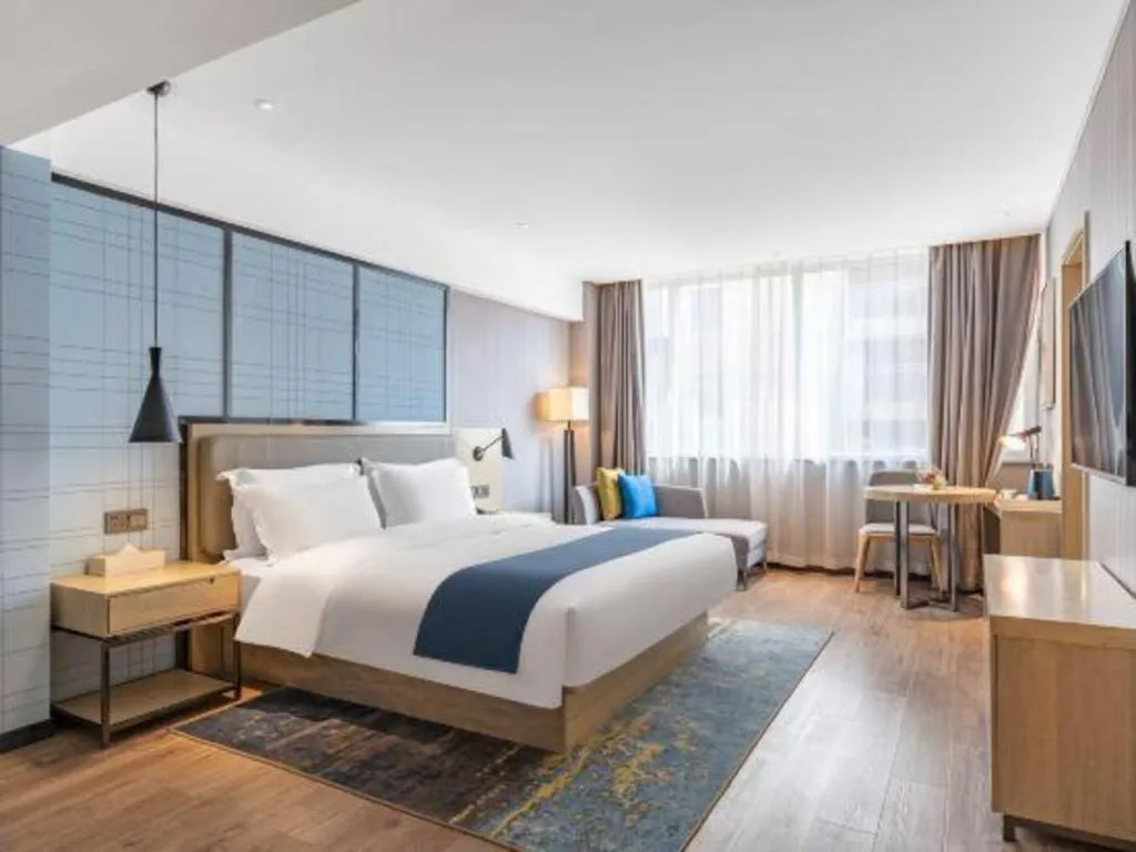 Bed in Echarm Hotel Zibo Gaoqing Zhongcheng Inernational