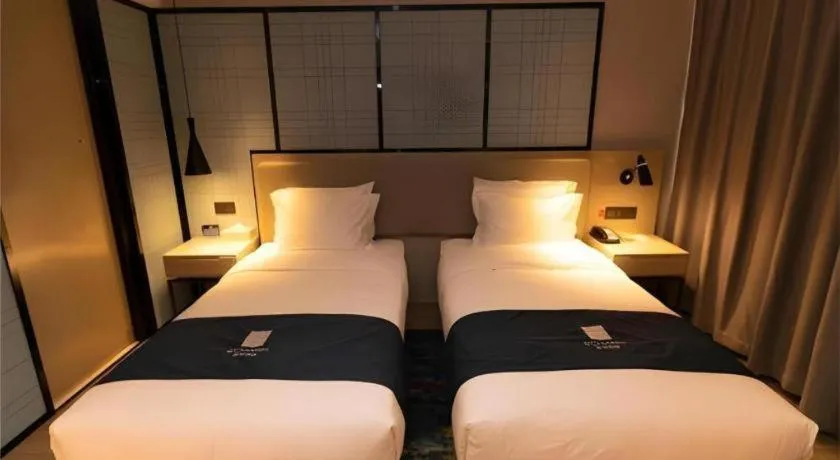 Bed in Echarm Hotel Zibo Gaoqing Zhongcheng Inernational