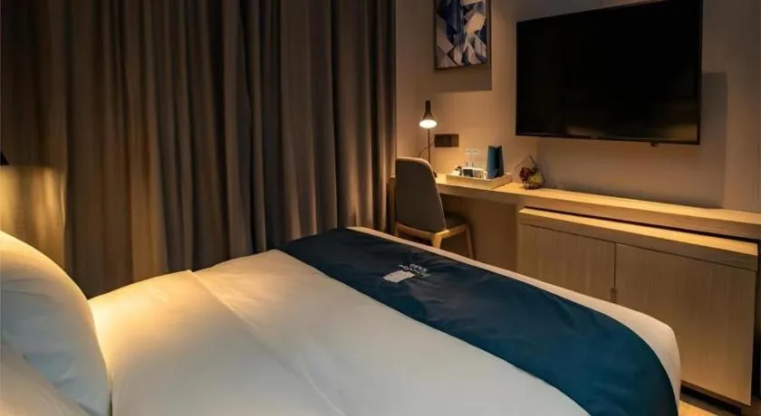 Bed in Echarm Hotel Zibo Gaoqing Zhongcheng Inernational