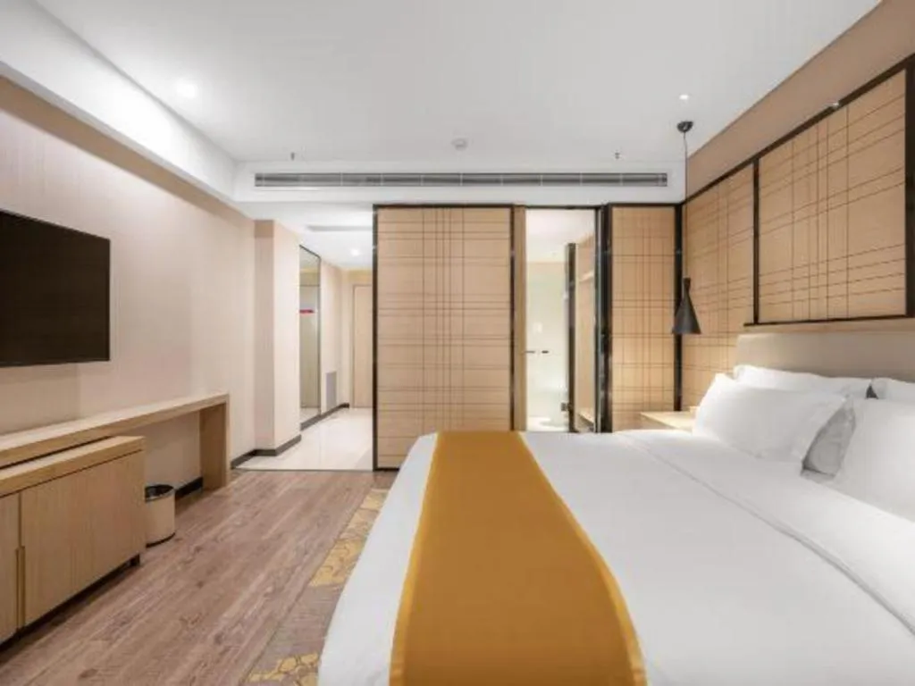 Bed in Echarm Hotel Zibo Gaoqing Zhongcheng Inernational