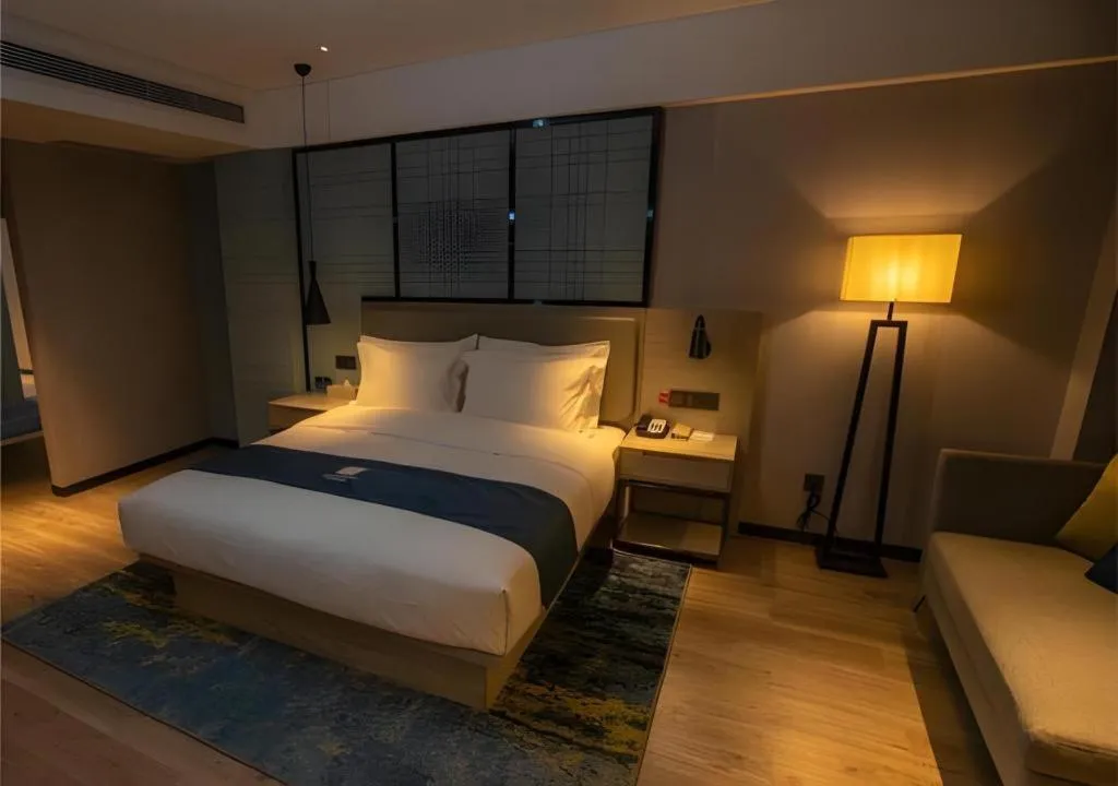 Bed in Echarm Hotel Zibo Gaoqing Zhongcheng Inernational