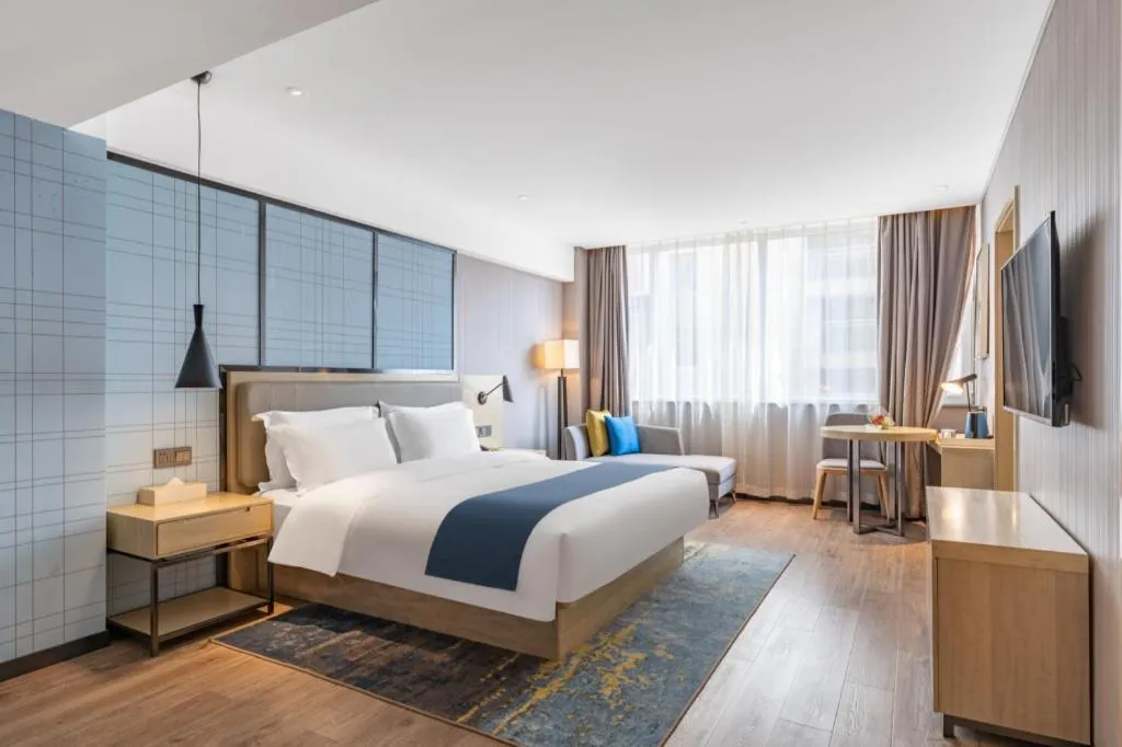 Bed in Echarm Hotel Zibo Gaoqing Zhongcheng Inernational