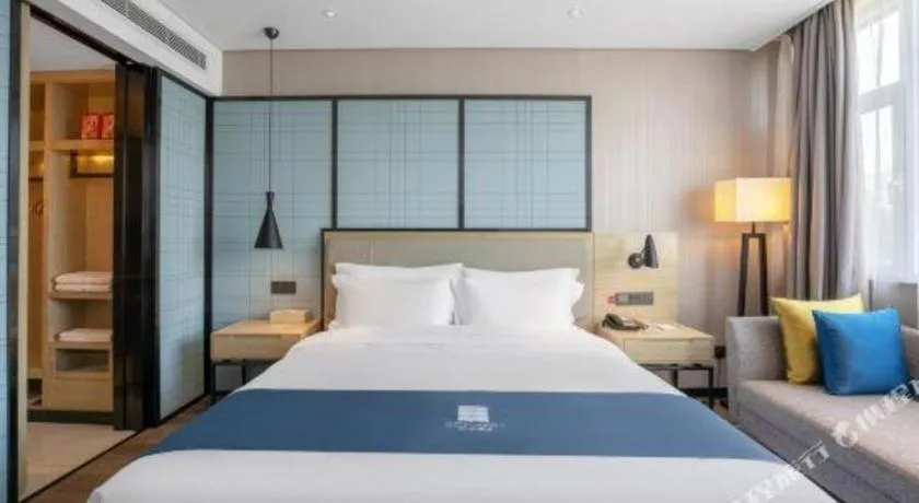 Bed in Echarm Hotel Zibo Gaoqing Zhongcheng Inernational