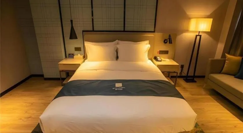 Bed in Echarm Hotel Zibo Gaoqing Zhongcheng Inernational