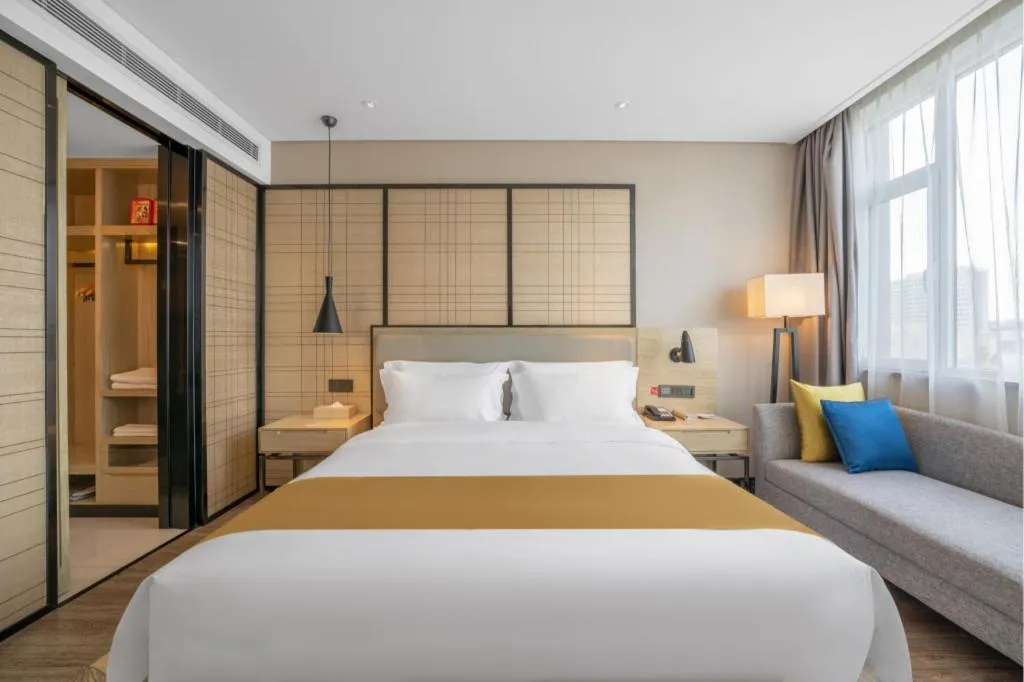 Bed in Echarm Hotel Zibo Gaoqing Zhongcheng Inernational