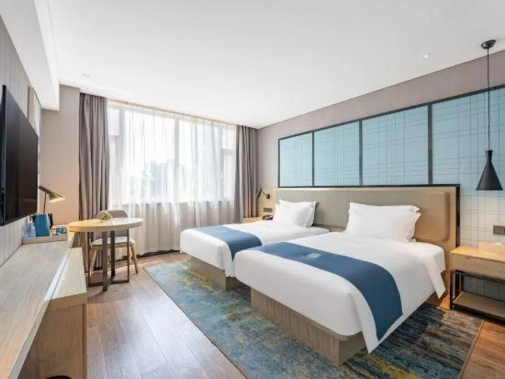 Bed in Echarm Hotel Zibo Gaoqing Zhongcheng Inernational